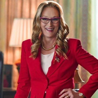 Meryl Streep posing in a red outfit